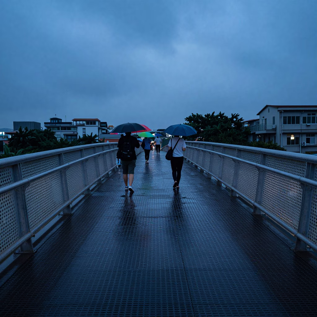 Kaohsiung Taiwan Indigo Twilight Pedestrian Overpass with Wet Footsteps and Umbrellas in in Kaohsiung, Taiwan