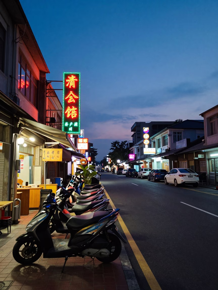 Kaohsiung Taiwan indigo twilight street scene with neon signs and local life in in Kaohsiung, Taiwan