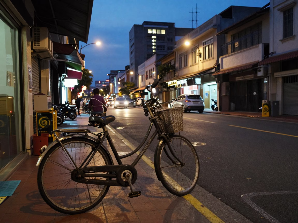 Kaohsiung Taiwan street scene at dusk with bicycle basket and power substation lattice in in Kaohsiung, Taiwan
