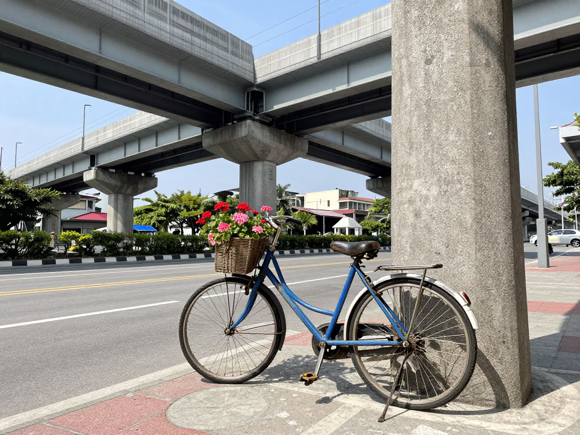 Kaohsiung Taiwan Street Scene with Bicycle and Geraniums in Bright Midmorning Light in in Kaohsiung, Taiwan