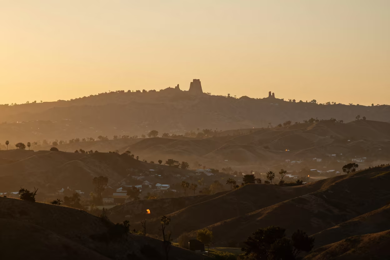Karst Tower Silhouette in Evening Mist in from a ridge above layered foothills near Highland Park, Los Angeles