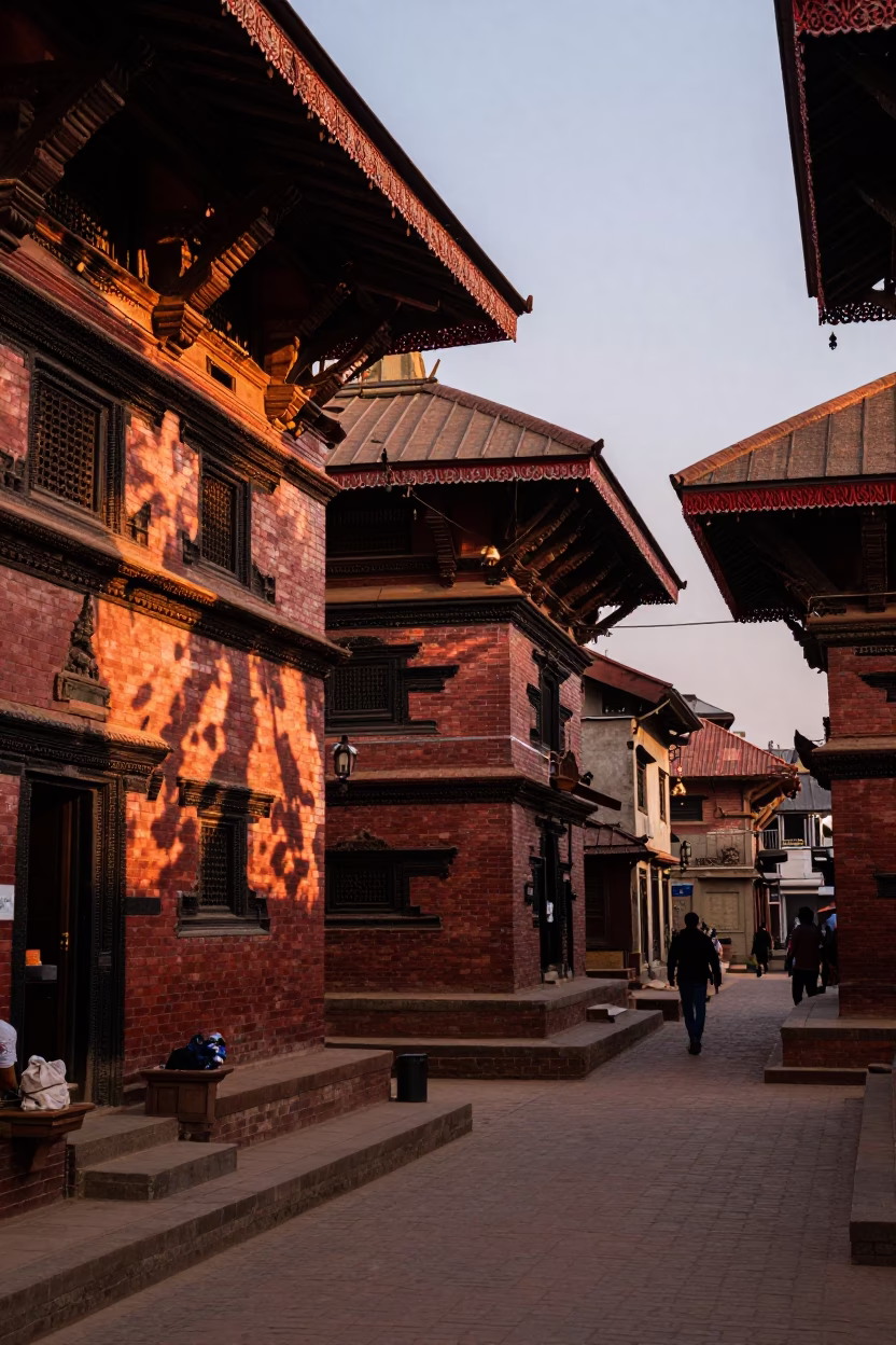 Kathmandu Nepal street scene in copper-toned light before dusk with local life in in Kathmandu, Nepal