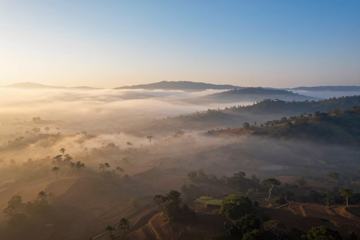 Kerala Valley Fog Sea Sunrise Over Thunderheads in over a horizon of stacked thunderheads in Kerala