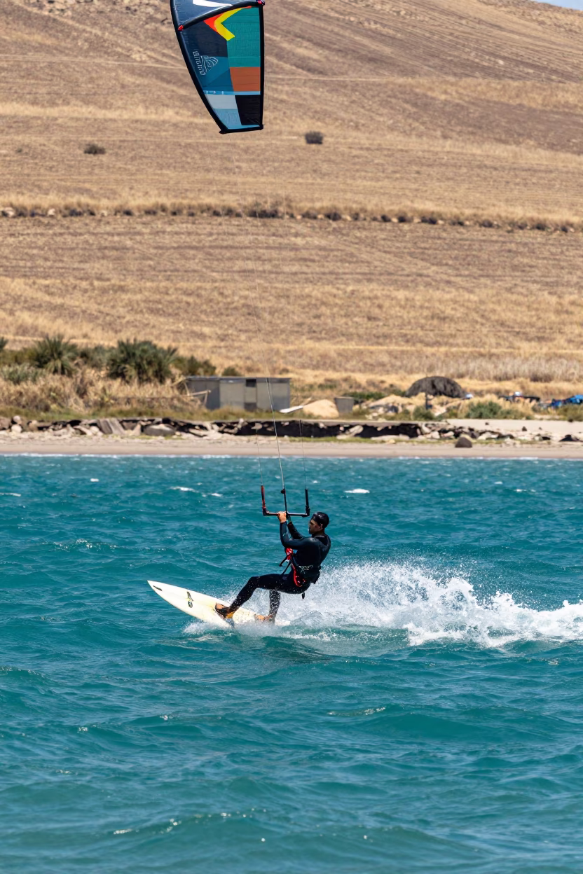Kite Surfer Soaring Over Turquoise Water in near open fields near Gdansk