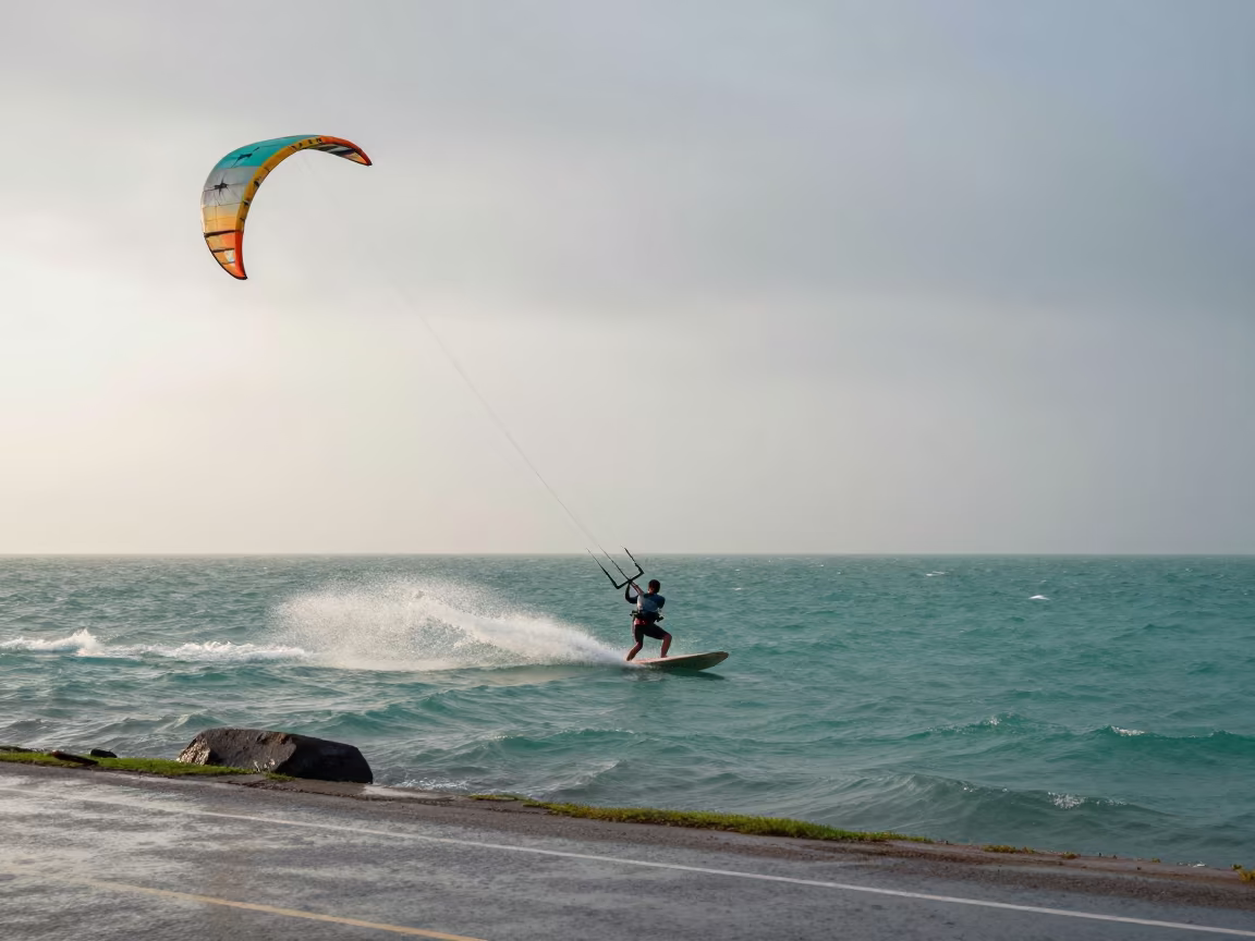 Kitesurfer Boosting Over Turquoise Water at Dawn in at a roadside stop near Cox's Bazar