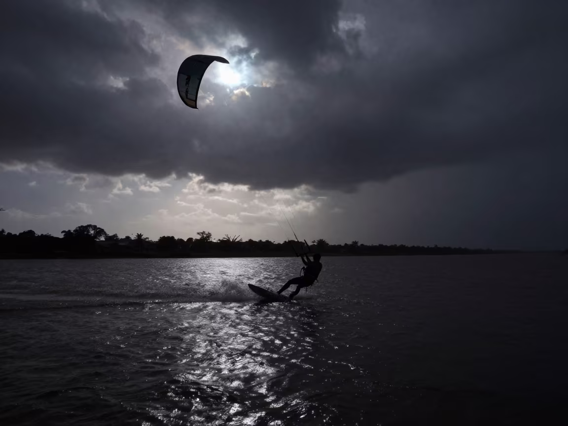 Kitesurfer Soaring Over Rio Night Storm in by a riverbank near Brasilia