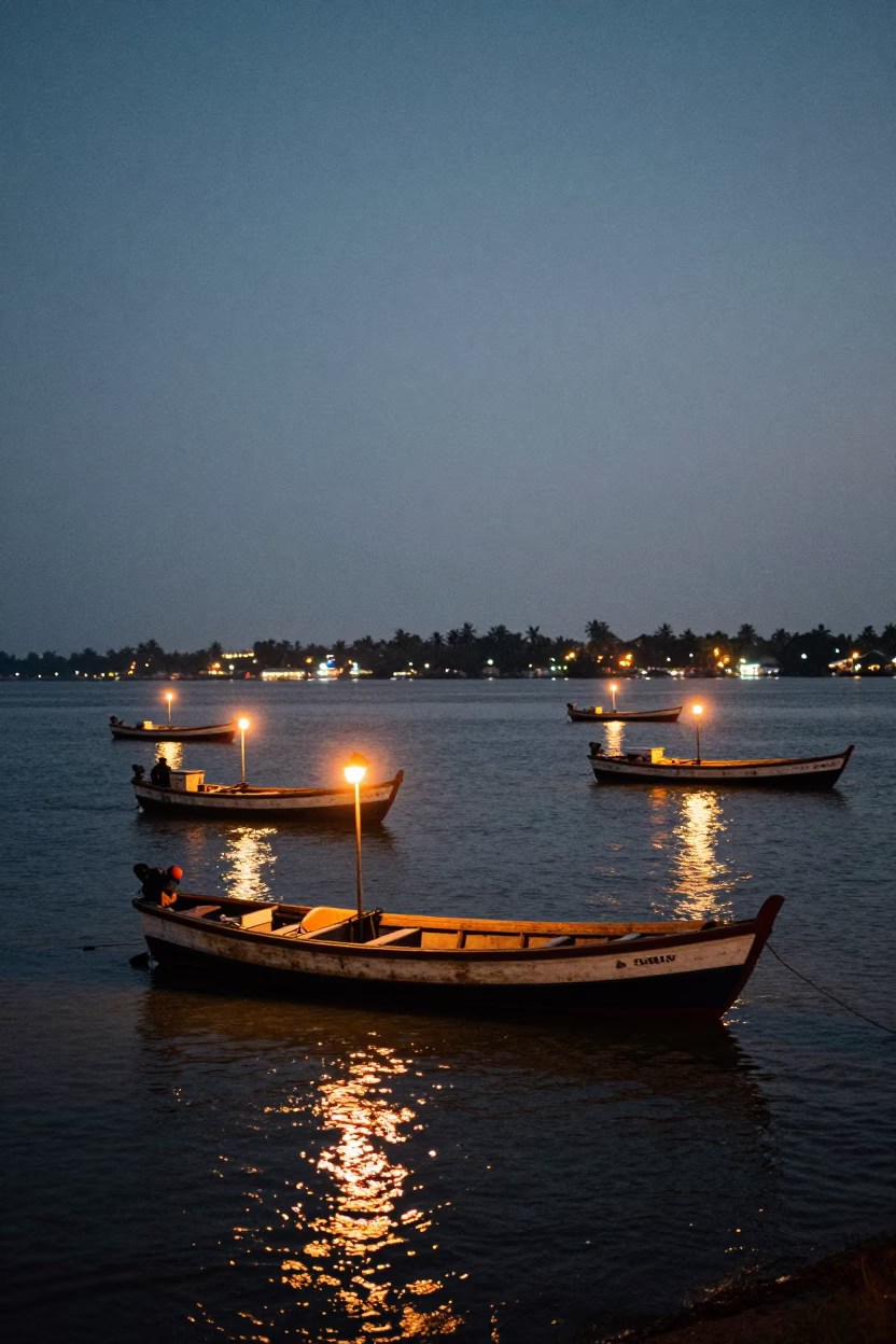 Kochi India City Lights Glow Over Fort Kochi Fishing Boats and Harbor in in Kochi, India
