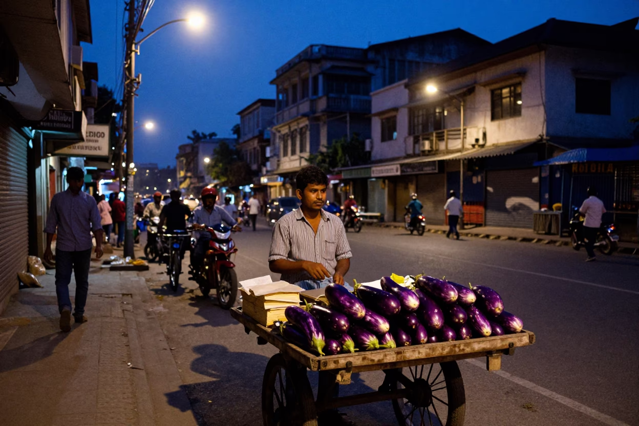 Kolkata Street Scene at Indigo Twilight with Vendor and Eggplants in in Kolkata, India