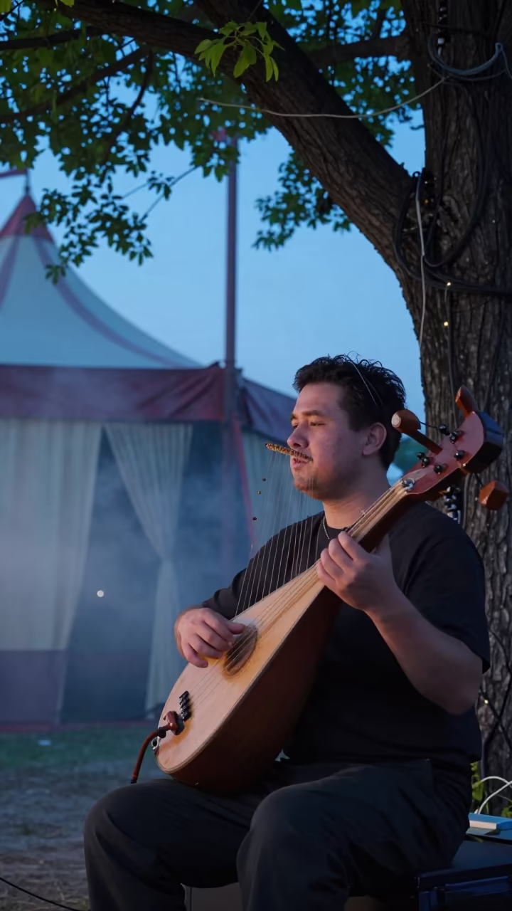 Kora Player Under Neem Tree at Twilight in Seoul in under a circus tent in Jongno, Seoul