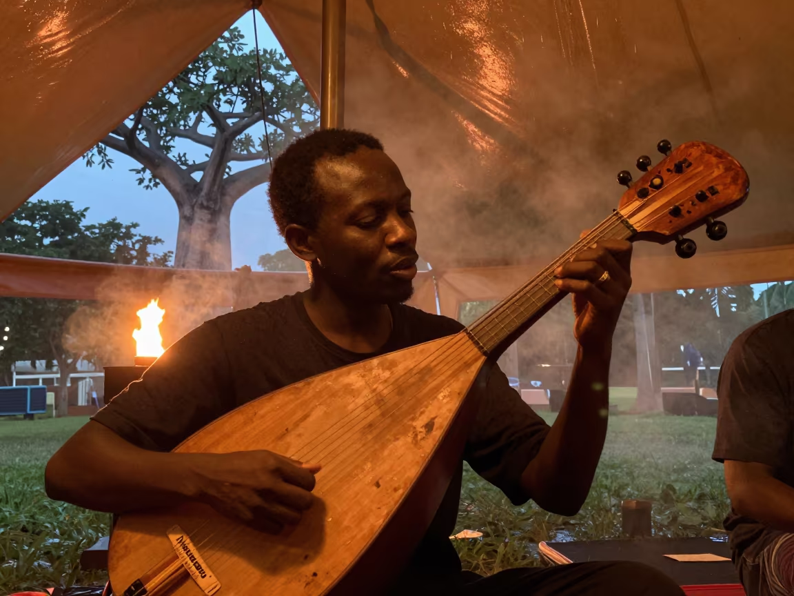Kora Player Under Baobab at Singapore Circus in under a circus tent in Clarke Quay, Singapore