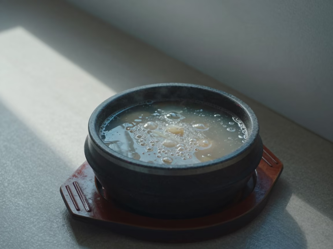 Korean Army Stew Bubbling Over in Jalingo in on a lacquered tray in Jalingo