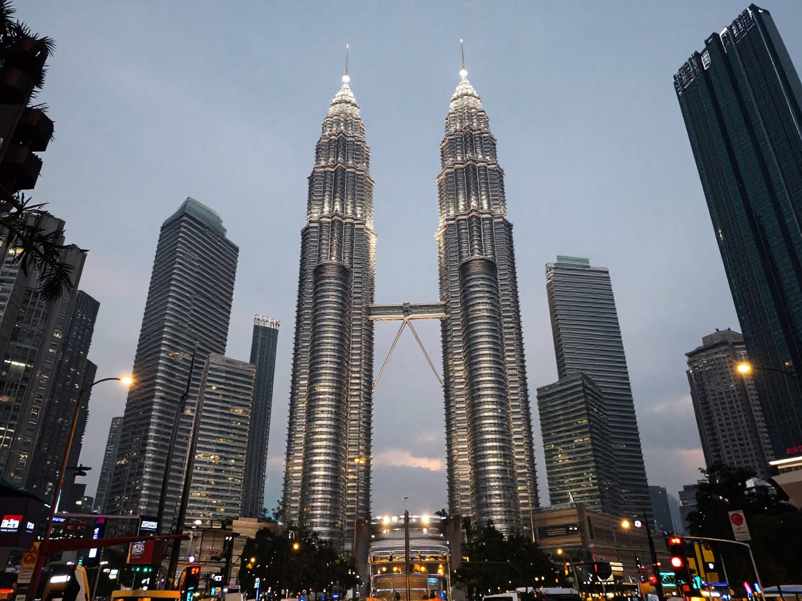 Kuala Lumpur City Centre Petronas Towers and Jalan Ampang Street Scene at Early Evening in in Kuala Lumpur, Malaysia
