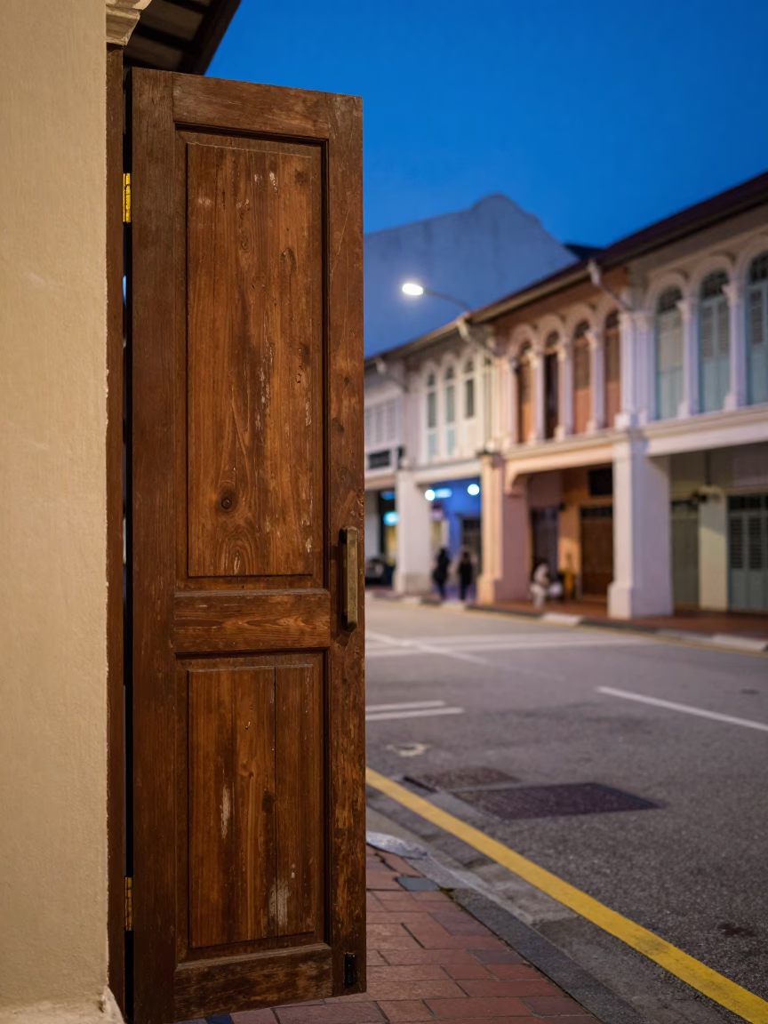 Kuala Lumpur indigo twilight street scene with vintage 1950s architecture and local commerce in in Kuala Lumpur, Malaysia