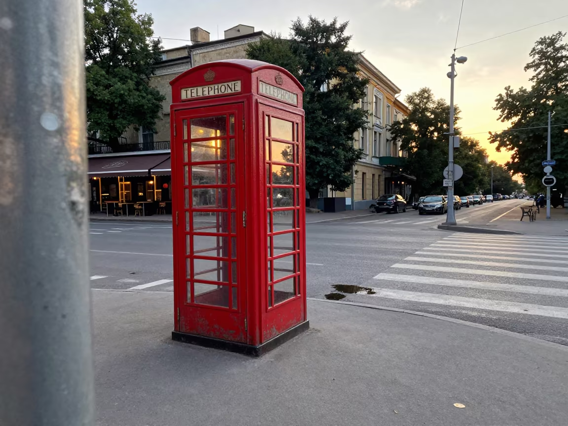 Kyiv Phone Booth Puddle Reflection Sunset in outside a corner cafe in Kyiv