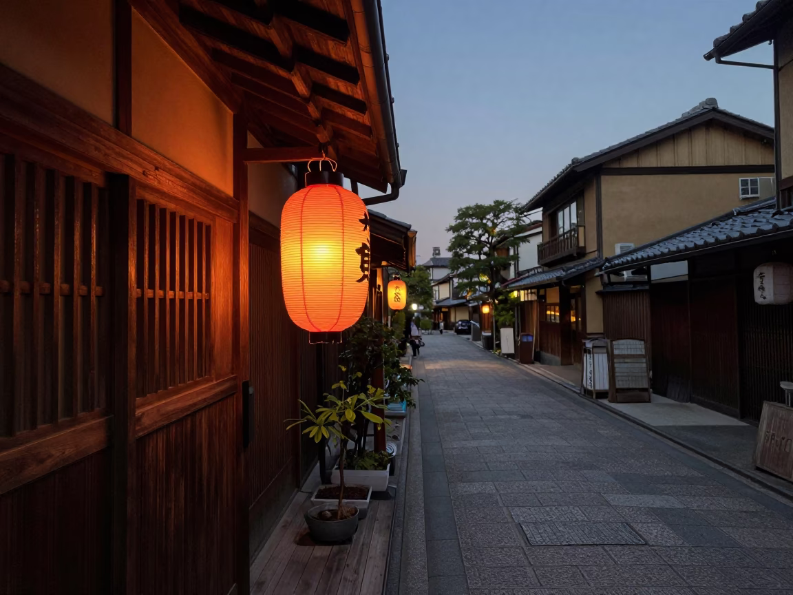 Kyoto Evening Street Scene with Lantern and Houseplant in Honeyed Light in in Kyoto, Japan