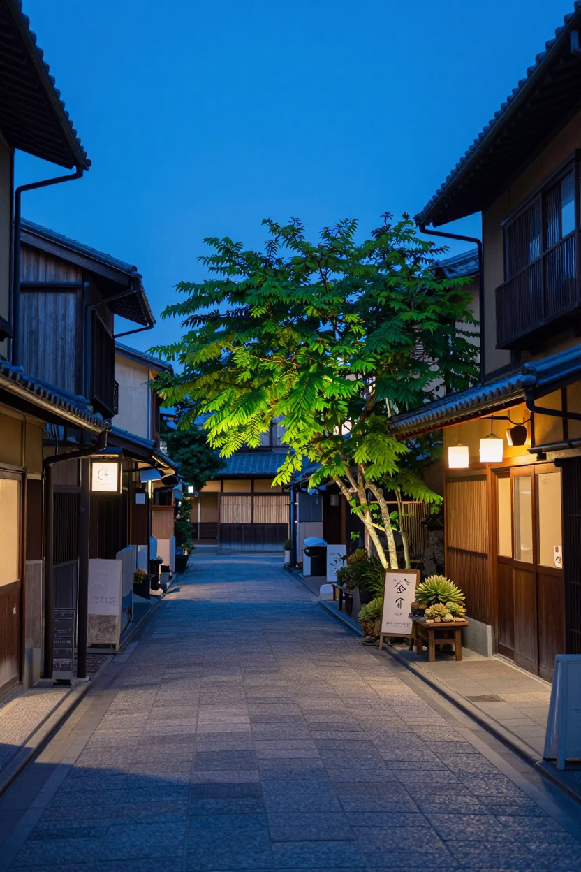 Kyoto Japan evening blue light street scene with succulent cafe wall and pedestrians in in Kyoto, Japan