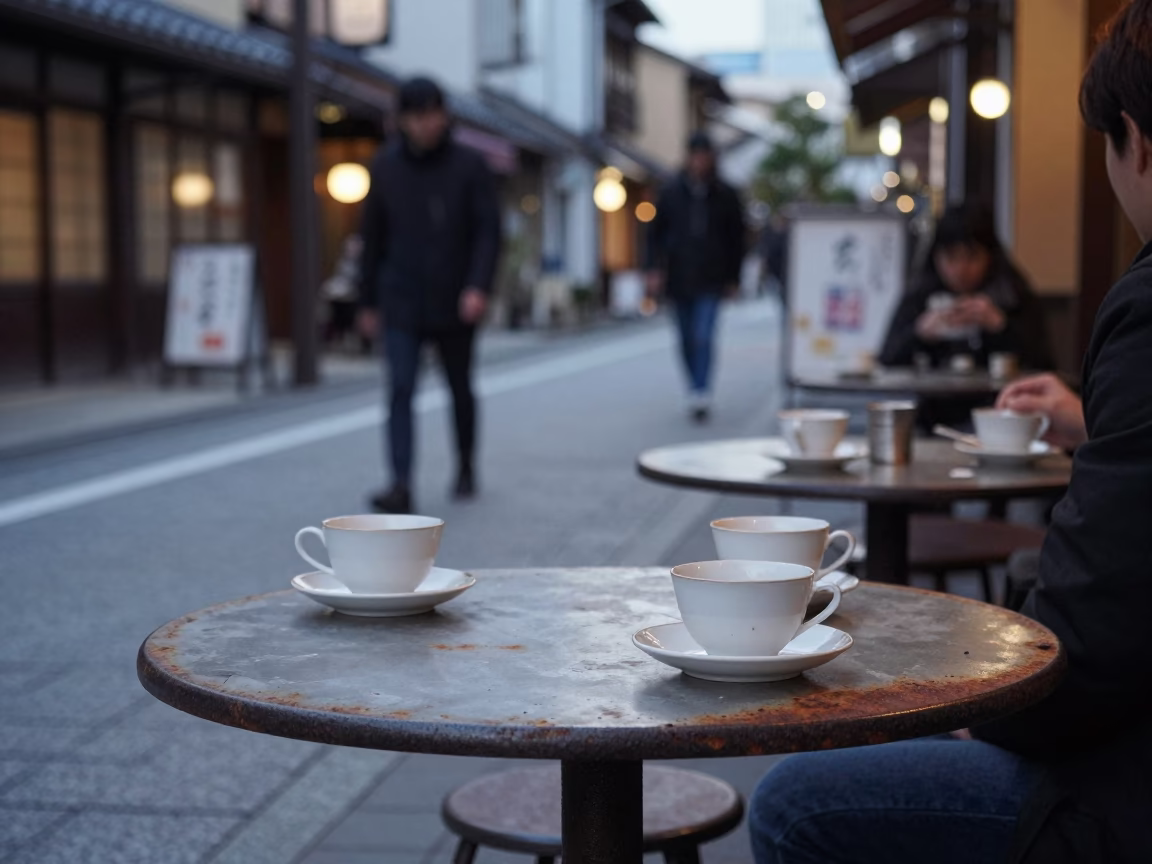 Kyoto Japan Evening Street Scene with Teacups and Rusty Tabletop at Dusk in in Kyoto, Japan
