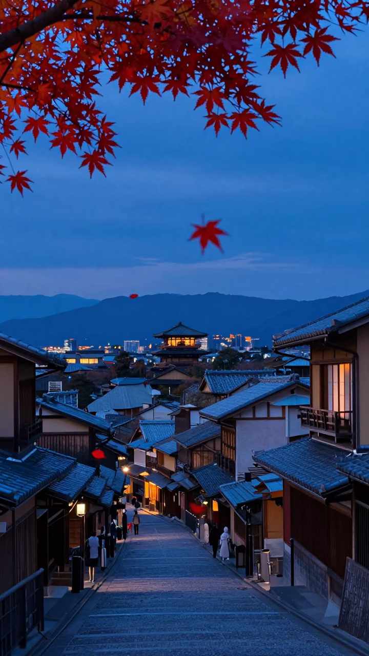 Kyoto Japan indigo twilight street scene with falling maple leaves and traditional architecture in in Kyoto, Japan