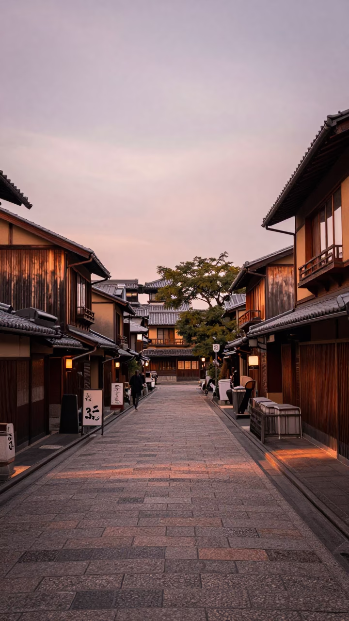 Kyoto Street Scene in Copper Dusk Light with Traditional Lanterns and Pedestrians in in Kyoto, Japan