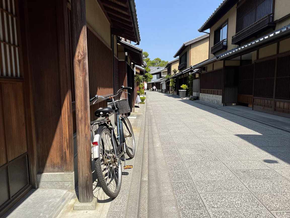 Kyoto Street Scene Under Noon Sun with Bicycle and Shop Signage in in Kyoto, Japan