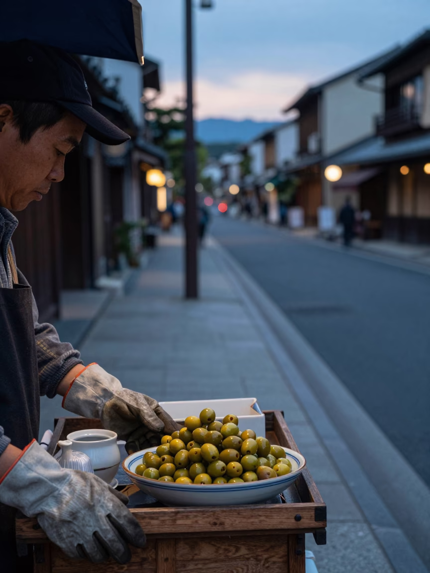 Kyoto Street Vendor Early Evening Scene with Work Gloves and Olive Dish in in Kyoto, Japan