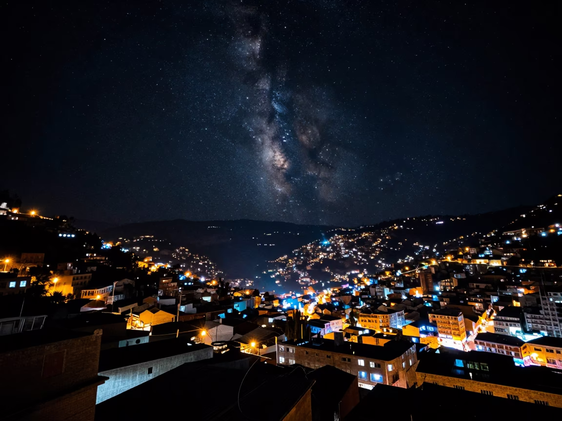 La Paz Bolivia Night Sky Above Urban Rooftops and Street Lights in in La Paz, Bolivia