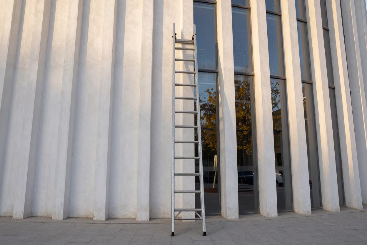 Ladder Against Whitewashed Ribbed Wall in inside a ribbed concrete lobby near Urumqi