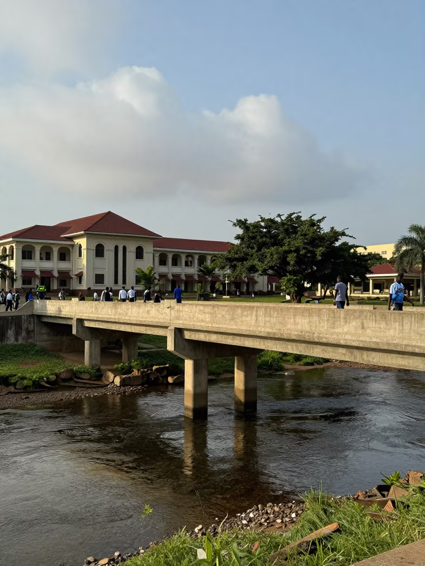 Lagos University Bridge Over Stream in Late Afternoon in beneath a university cloister near Lagos