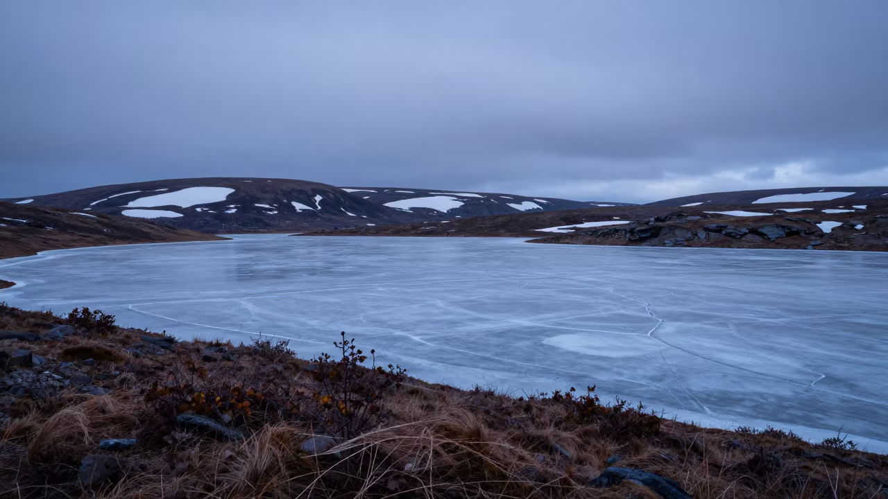 Lapland Tundra Lake Steel Blue Evening Light in from a ridge above layered foothills in Lapland