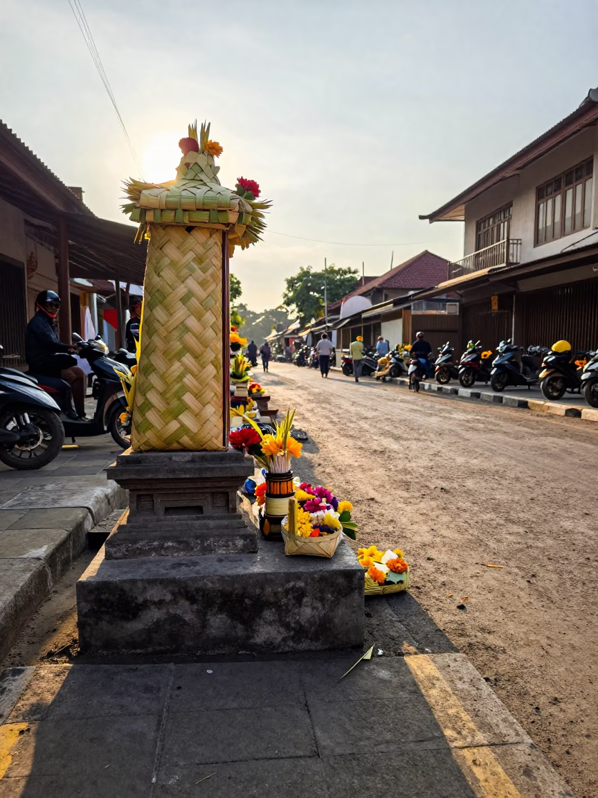 Late Afternoon Balinese Street Scene in Denpasar with Traditional Offerings and Daily Life in in Denpasar, Indonesia