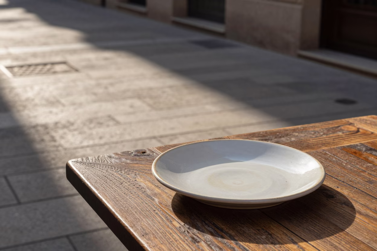 Late Afternoon Barcelona Street Scene with Ceramic Plate and Tea Stains in in Barcelona, Spain