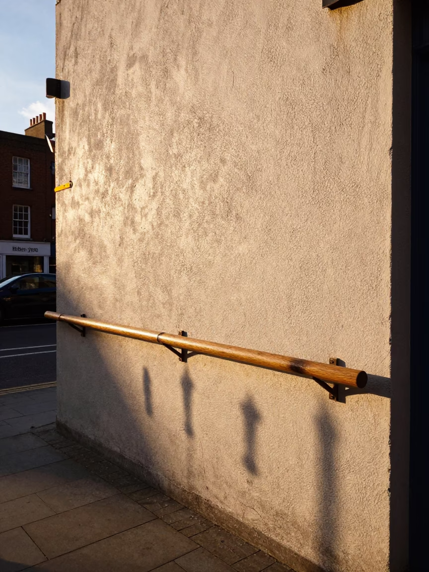 Late Afternoon Dublin Street Scene with Peg Rail Shadow and Local Life in in Dublin, Ireland