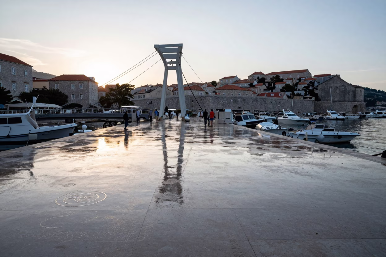 Late Afternoon Dubrovnik Harbor Scene with Drawbridge Markings and Historic Stone Walls in in Dubrovnik, Croatia