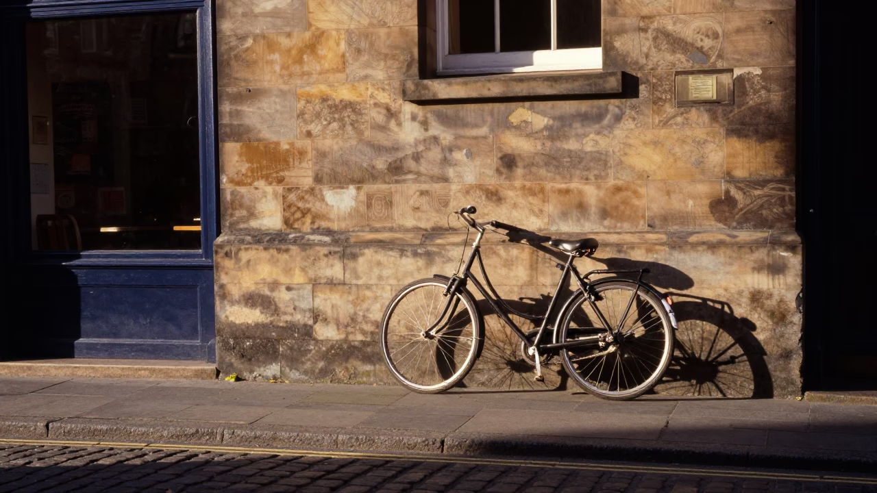 Late Afternoon Edinburgh Street Scene with Bicycle Leaning Against Cafe Wall in in Edinburgh, United Kingdom