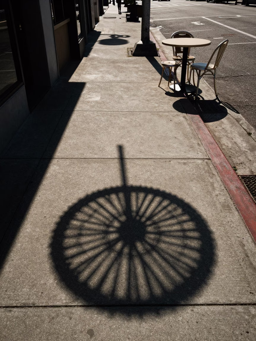 Late Afternoon Light on Los Angeles Sidewalk with Wicker Shadow and Striped Fabric in in Los Angeles, California, United States