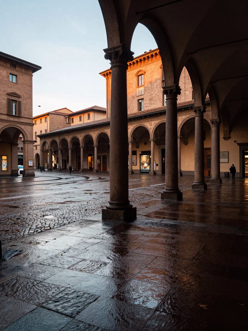 Late Afternoon Street Scene in Bologna Italy with University Arcade and Wet Leaves in in Bologna, Italy