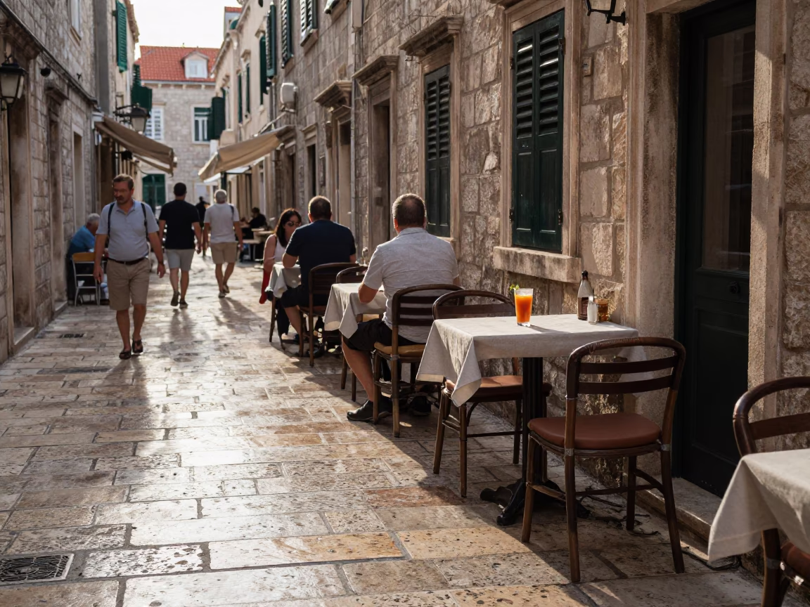 Late Afternoon Street Scene in Dubrovnik Croatia with Local Dining and Clumber Spaniel in in Dubrovnik, Croatia