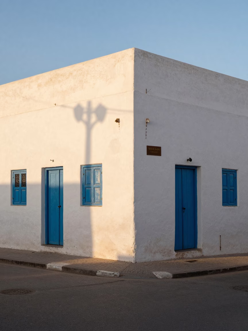 Late Afternoon Street Scene in Essaouira Morocco with White Walls and Blue Doors in in Essaouira, Morocco