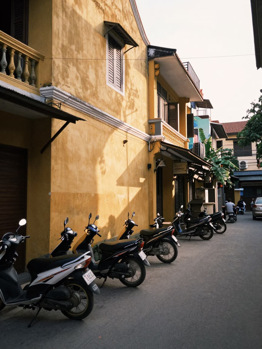 Late Afternoon Street Scene in Hanoi Vietnam with Motorbikes and Traditional Architecture in in Hanoi, Vietnam