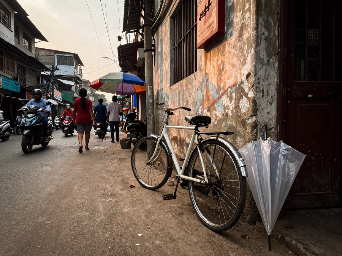 Late Afternoon Street Scene in Kolkata India with Bicycle and Umbrella in in Kolkata, India