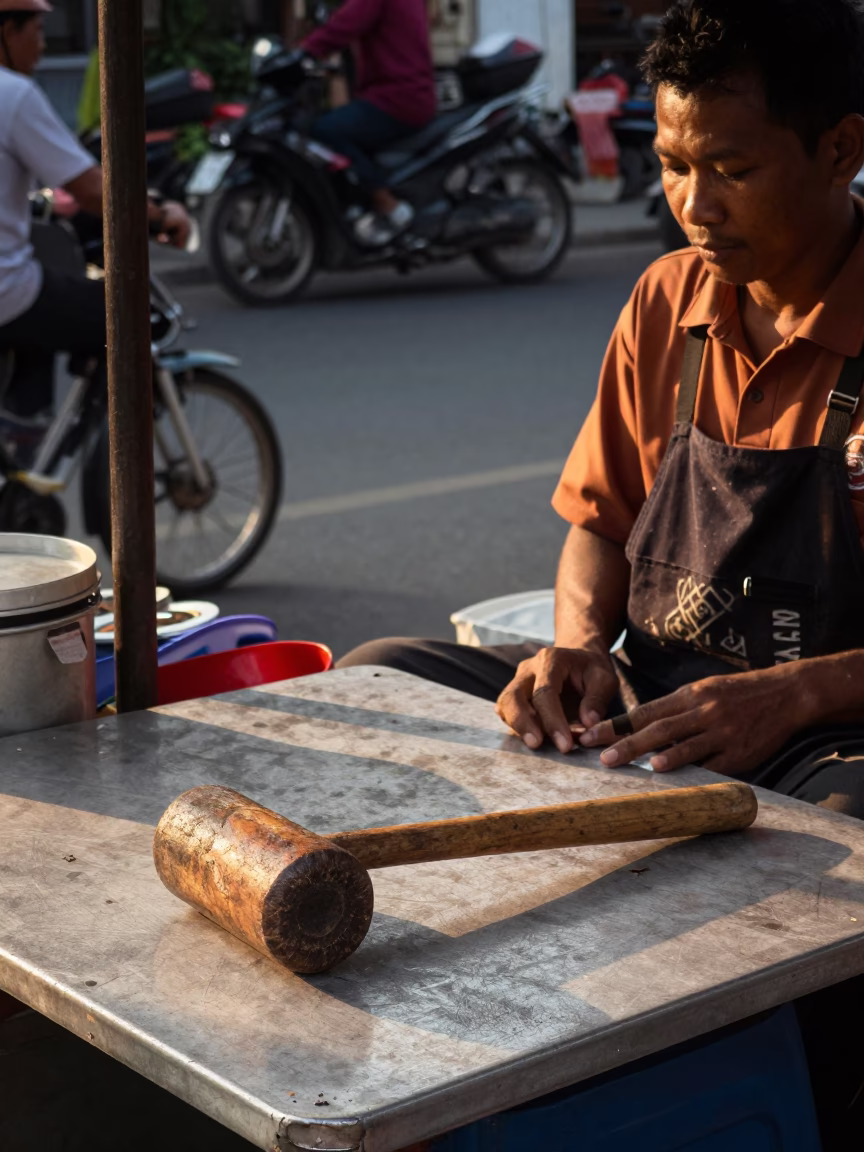 Late Afternoon Street Scene in Surabaya Indonesia with Wooden Mallet and Scratched Tabletop in in Surabaya, Indonesia