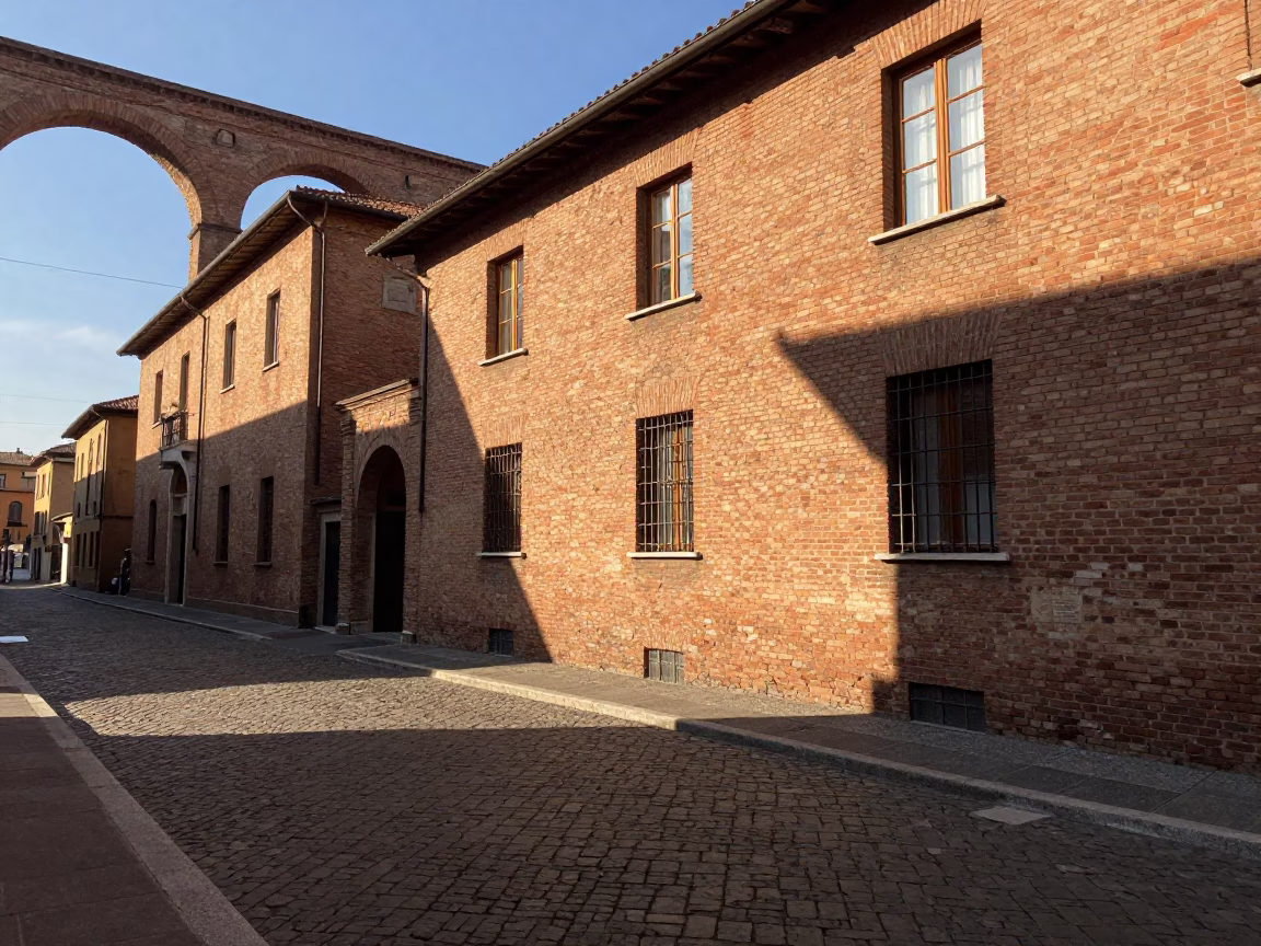 Late Afternoon Sunlight on Bologna's Historic Brick Architecture and Cobblestone Streets in in Bologna, Italy