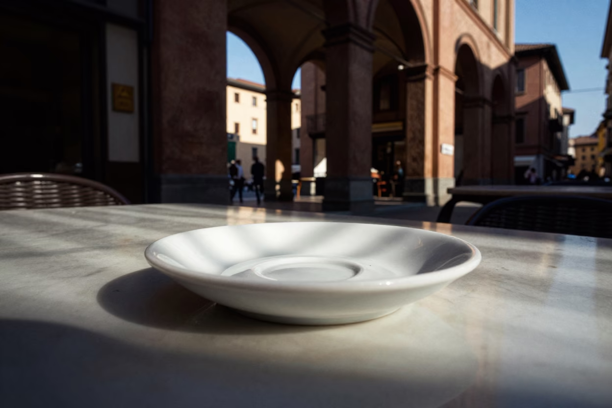 Late Afternoon Sunlight Stripes Across Ceramic Plates in Bologna Italy Street Cafe in in Bologna, Italy
