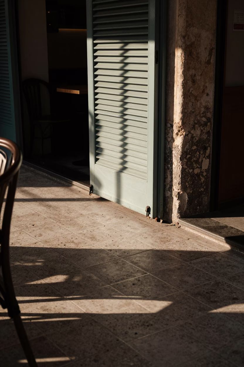 Late Afternoon Sunlight Stripes on Palermo Cafe Tile Grout with Vintage Coffee Grinder in in Palermo, Italy