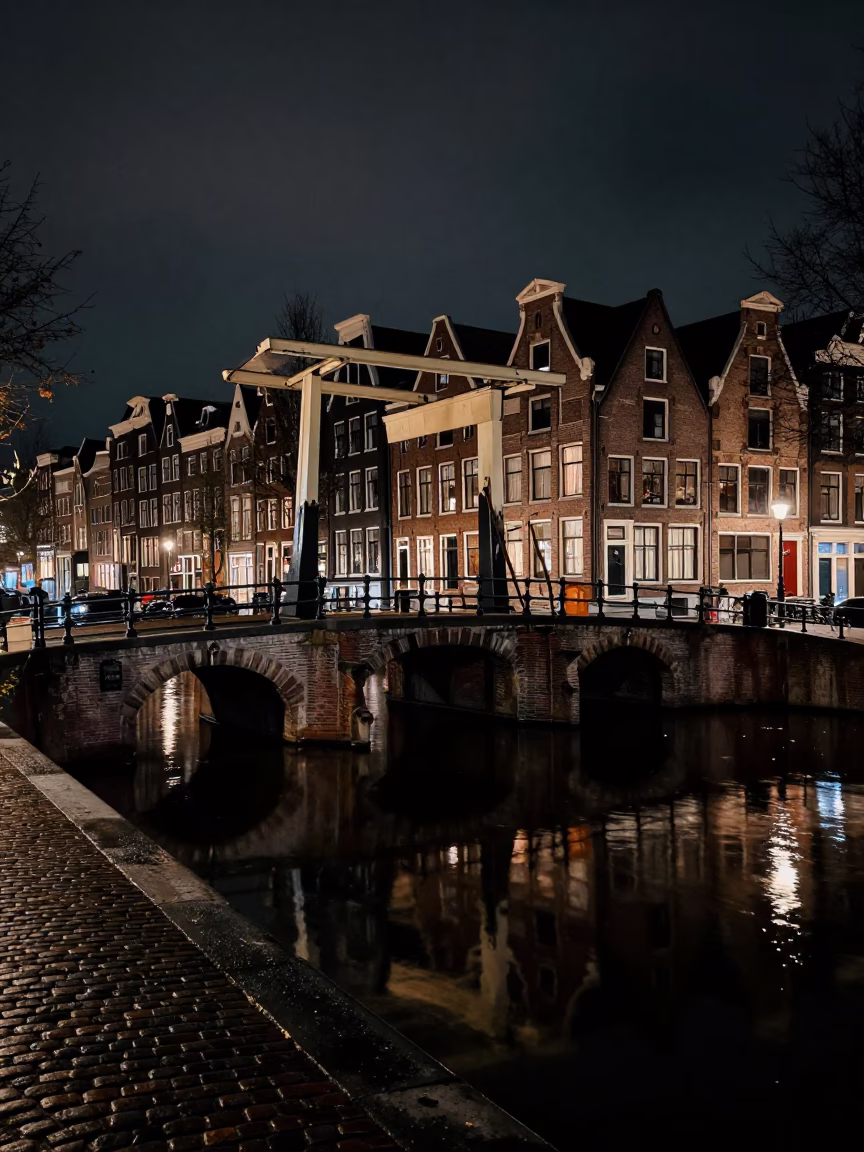 Late At Night Light on Tidal Water in Amsterdam in in Amsterdam, Netherlands