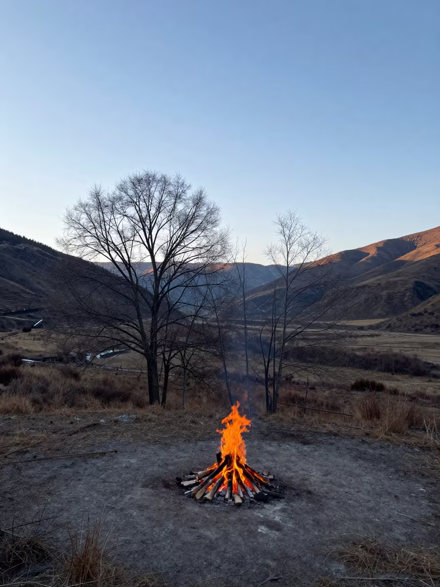 Late Autumn Bonfire in Haikou Valley in across a wide valley floor near Haikou