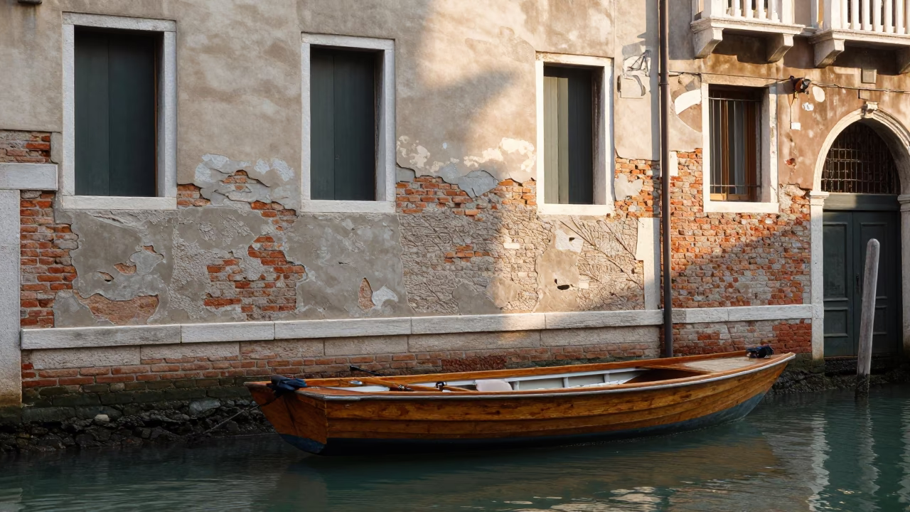 Late Morning Canal Scene in Venice Italy with Wooden Boat and Historic Stone Architecture in in Venice, Italy