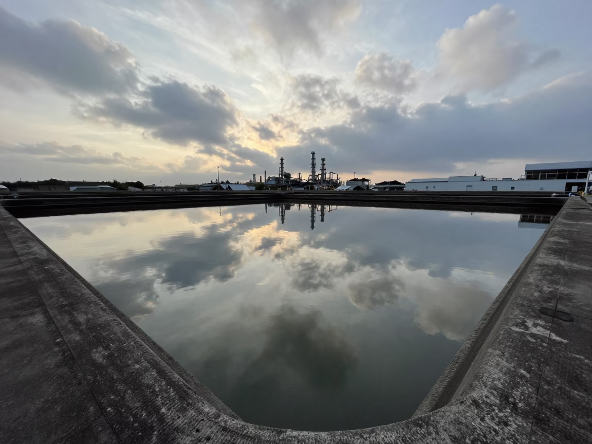 Late Morning Industrial Water Treatment Basin Reflecting Clouds in Kaohsiung Taiwan in in Kaohsiung, Taiwan