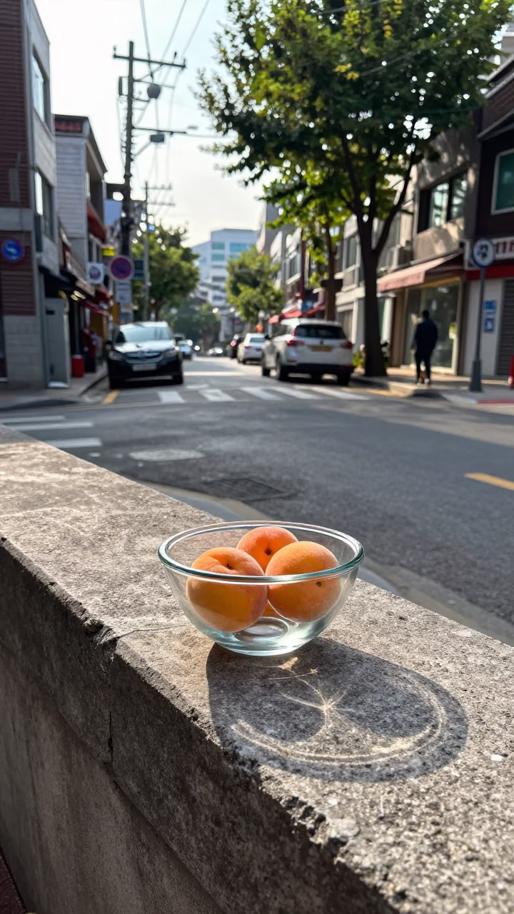 Late Morning Seoul Street Scene with Apricots and Glass Bowl on Concrete Sidewalk in in Seoul, South Korea