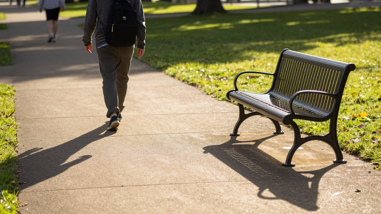 Late Morning Sunlight on Adelaide Parklands Pathway with Casual Pedestrian and City Skyline in in Adelaide, South Australia, Australia